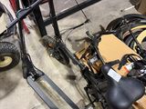 a scooter that is sitting on the floor in a garage
