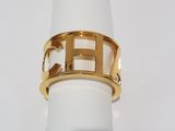 an image of a gold plated ring with the letter h on it