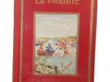 an old red book with a picture of people in a boat