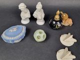 a lot of small figurines that are on a table