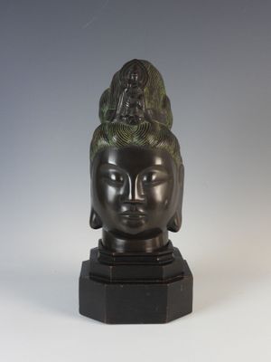 an image of a statue of a woman ' s head on a marble base