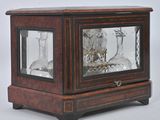 a glass case with a clock inside of it