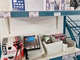 a shelf with various items on it in a store