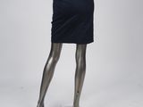 a mannequin wearing a black dress and high heels