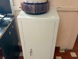 a machine that is sitting on top of a cabinet