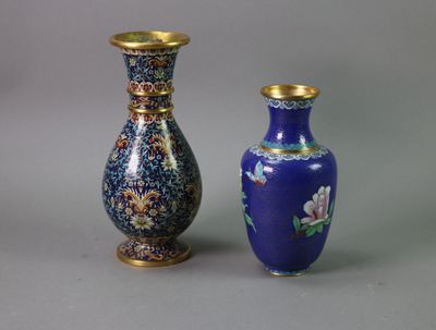 two vases sitting next to each other on a table