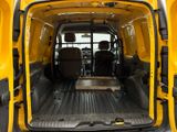 a yellow van with a table in the back of it