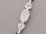a close up of a silver and black beaded bracelet