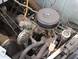 a close up of a car ' s engine with the hood open