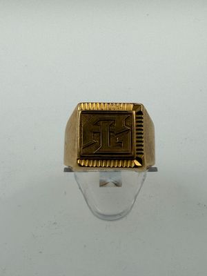 an image of a gold signet ring with the letter r on it