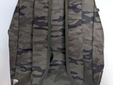 the back view of a backpack with a zipper on it