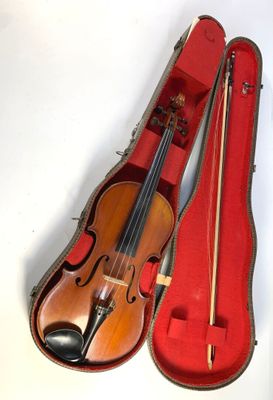 a violin in a case with a bow in it