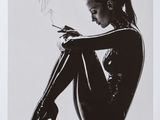 black and white photograph of a woman in latex smoking a cigarette