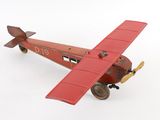 a toy airplane that is sitting on a white surface