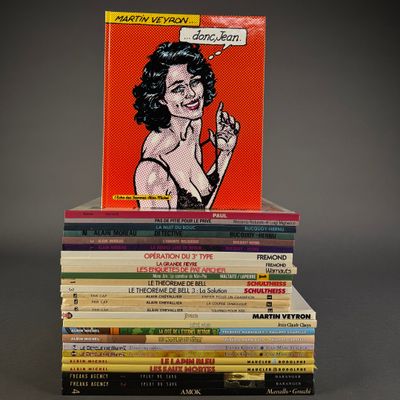 books stacked on top of each other on a gray surface
