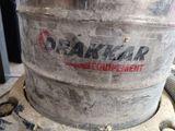 a large metal keg sitting on top of a table