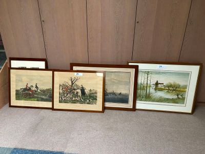 three framed pictures on the floor of a living room