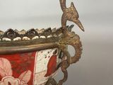 an image of a red and white bowl with a bird on it