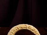 a close up of a banana on a table with a dark background