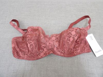 a close up of a pink bra with a tag on it