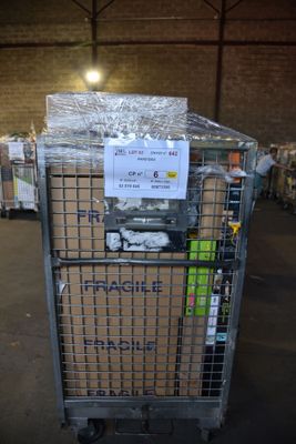 a cart that has a bunch of boxes in it