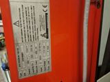 a fire extinguisor that is sitting in a room