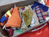 a box full of clothes sitting on the floor