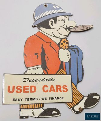 a sign that says used cars with a man smoking a cigarette