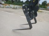 a fork that is sitting on the side of the road
