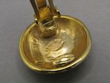 a close up of a gold plated object on a table