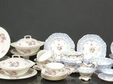 many different types of plates and bowls on the table