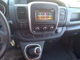 a car dashboard with a radio and a steering wheel