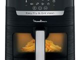 a close up of an air fryer with french fries in it