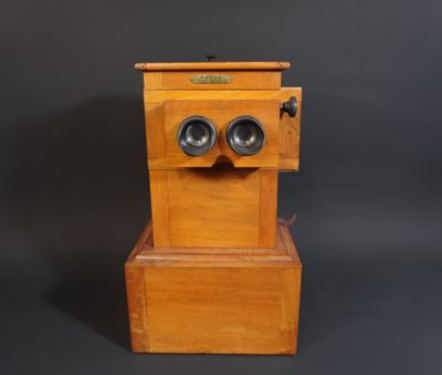 an old wooden box with two speakers sitting on top of it