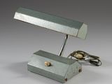 a small desk lamp that is sitting on a table
