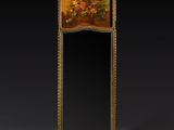 an ornately decorated mirror in the shape of a mirror with flowers on it