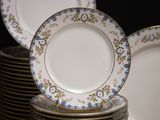 many plates stacked on top of each other on a table