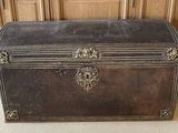 an old trunk sitting on the floor in a room