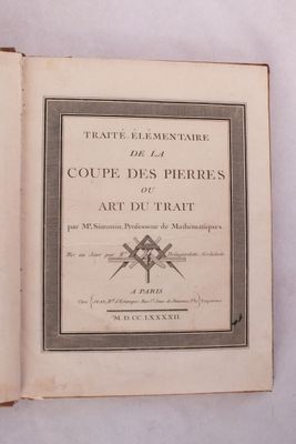 un livre ouvert sur lequel est posée l'image d'une paire de ciseaux