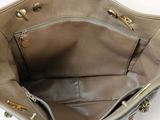 the inside of a purse with a chain hanging from it ' s handle