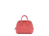 the small pink bag is sitting on a white surface