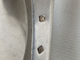 a spoon and a spoon rest on a table