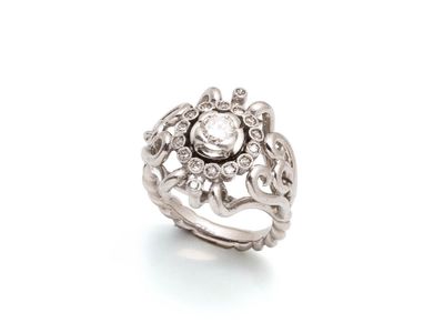 une image d'une bague en diamant sur fond blanc