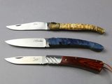 three different types of knives that are on a table