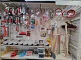 many different tools on the shelves in the store