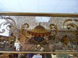 a reflection of a carousel in a mirror in a store