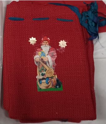 red sweater with a picture of a santa claus on it