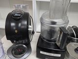 a blender and a blender sitting on a kitchen counter