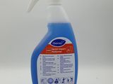 a close up of a bottle of blue liquid on a white surface