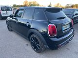 a picture of a black mini cooper parked in a parking lot